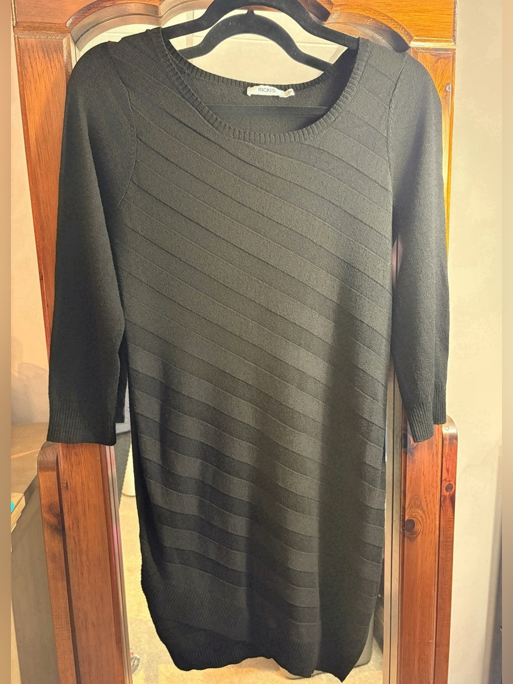 Ricki’s Asymmetrical Knit Sweater Dress with Three-Quarter Sleeves in Black